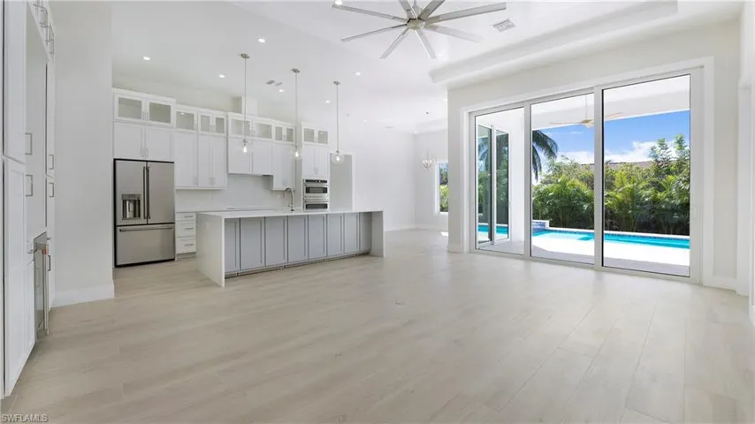 Unfurnished living room featuring recessed lighting, light wood-style flooring, and ceiling fan