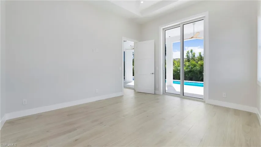 Spare room with light wood-style floors and baseboards
