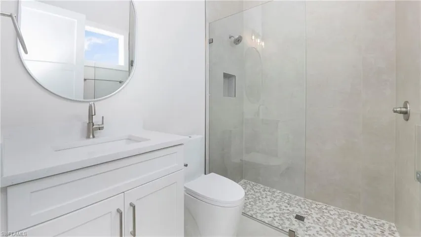 Bathroom featuring vanity and walk in shower