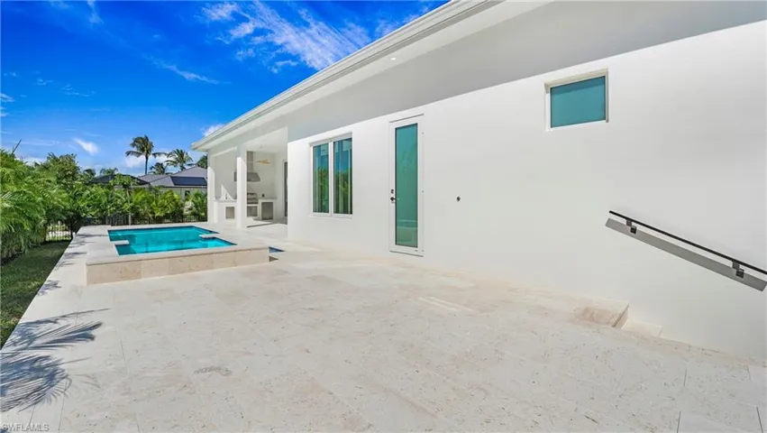 Outdoor pool featuring a patio