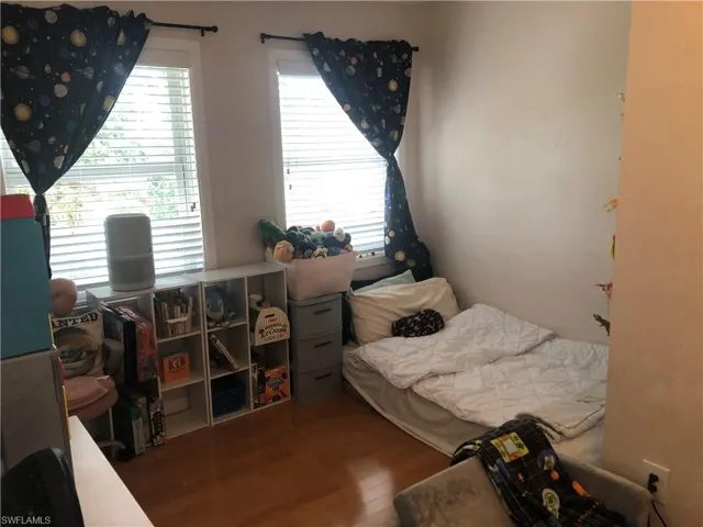 Bedroom with wood finished floors