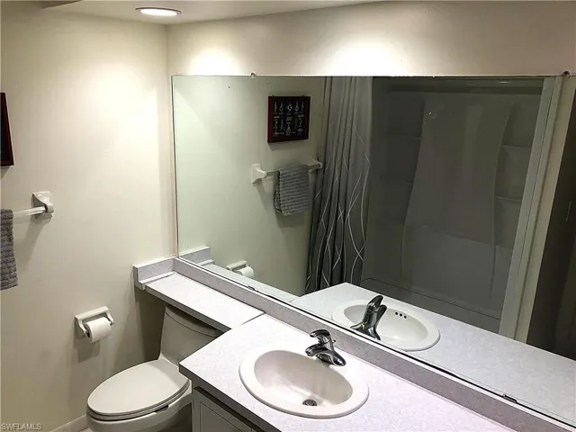 Full bathroom featuring vanity and a shower with curtain