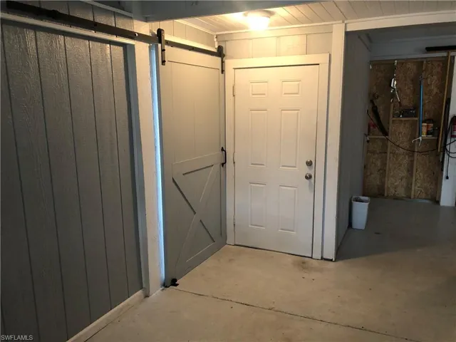 Below grade area with a barn door