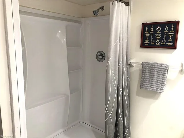 Bathroom with curtained shower