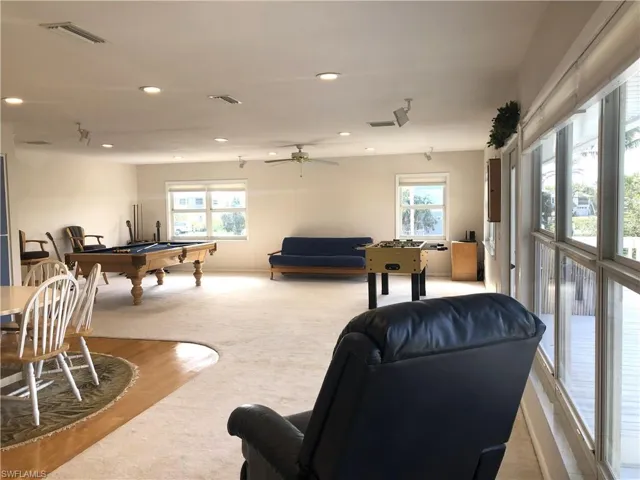 Playroom with healthy amount of natural light, pool table, carpet, recessed lighting, and a ceiling fan