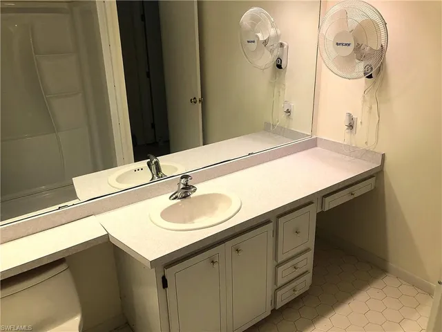 Bathroom with vanity and tile patterned floors
