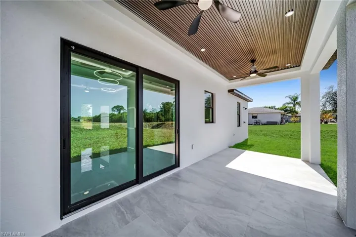 View of patio featuring a ceiling fan