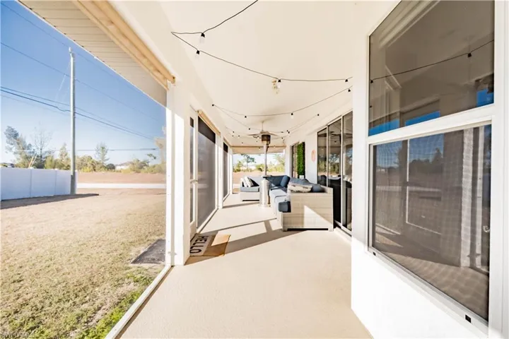 View of patio / terrace featuring a sunroom