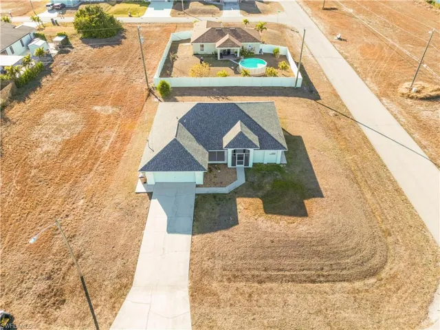 View from above of property with a pool area