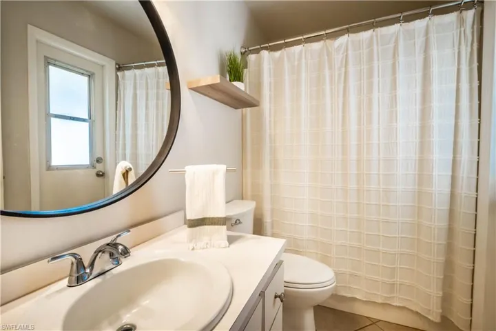 Bathroom with vanity and tile patterned flooring