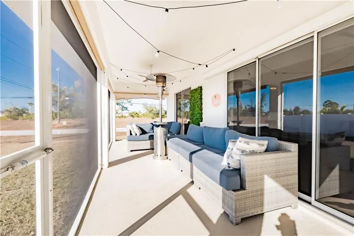 Sunroom featuring an outdoor lounge area and a patio