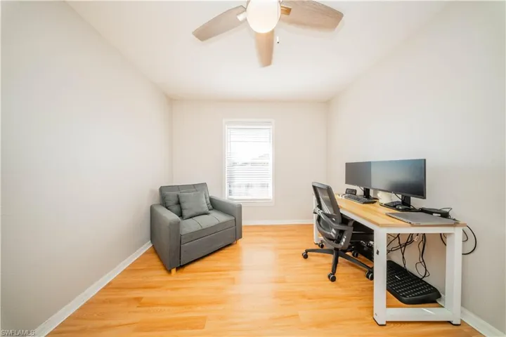 Office space featuring light wood-style flooring and ceiling fan