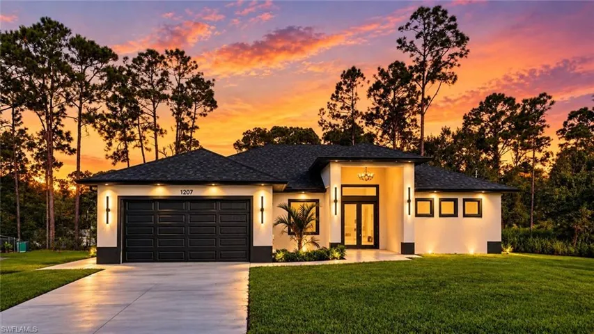 Modern exterior design featuring a dark asphalt shingle roof, a two-car garage, and a concrete driveway