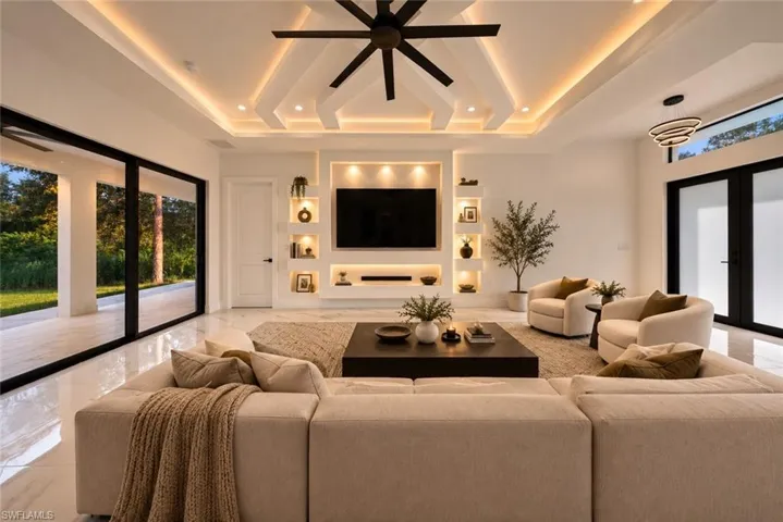 Tray ceiling with recessed lighting and contemporary fan