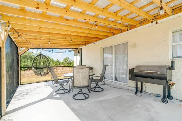 View of patio / terrace featuring outdoor dining space and grilling area
