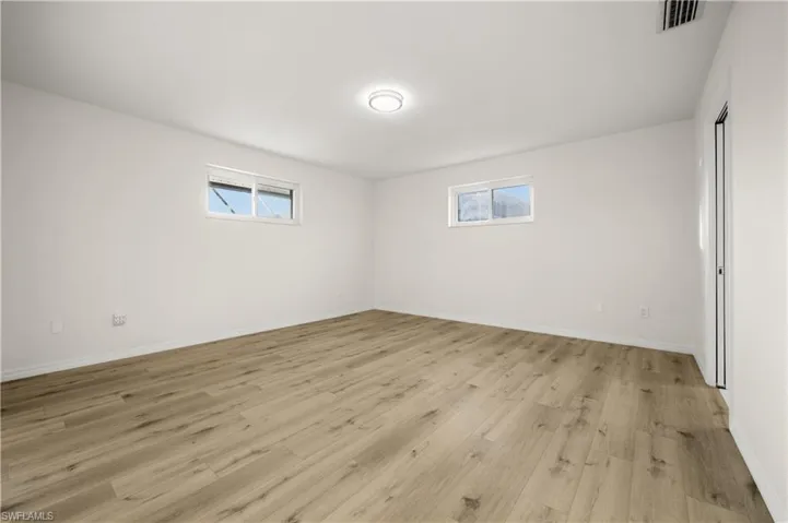 Empty room featuring light hardwood / wood-style flooring
