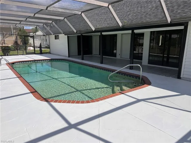 View of pool featuring a lanai and a patio
