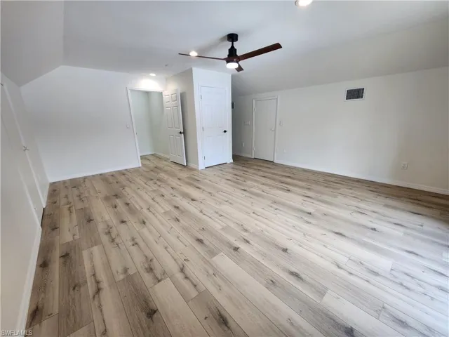 Bonus room featuring a ceiling fan, light wood-style flooring, recessed lighting, and vaulted ceiling