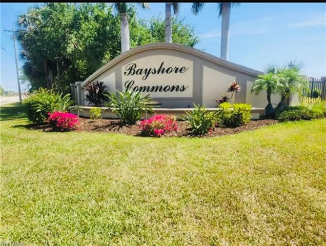 Community sign featuring a yard