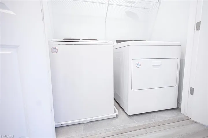 Clothes washing area with separate washer and dryer and laundry area
