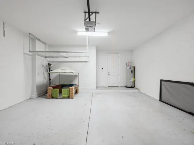 Garage with a garage door opener and water heater
