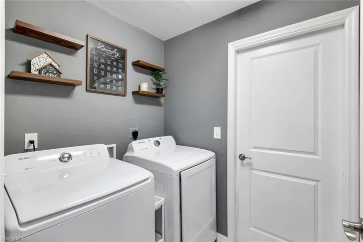 Laundry room featuring separate washer and dryer