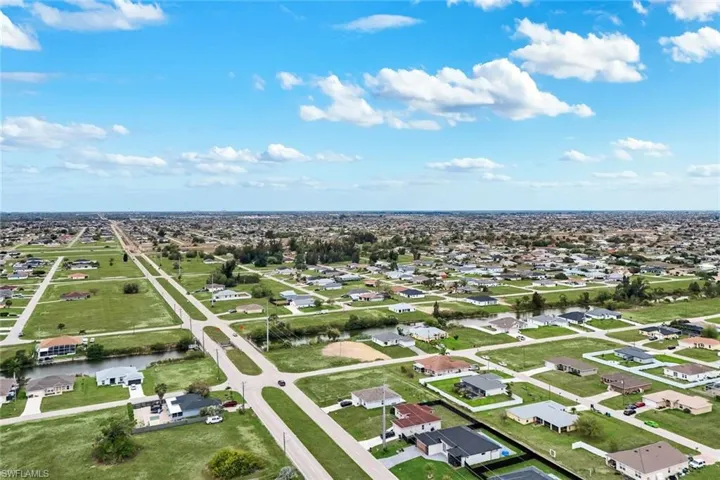 Aerial view of residential area with a nearby body of water