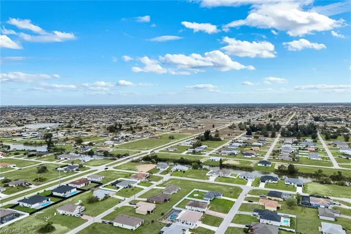 Aerial view of residential area with a large body of water