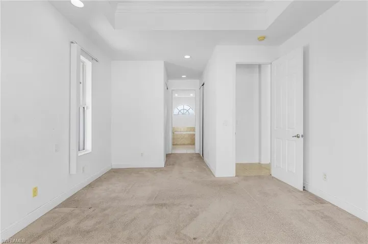 Spare room with light colored carpet