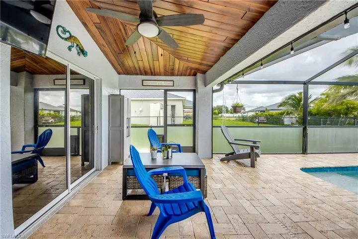 Sunroom / solarium featuring ceiling fan and lofted ceiling