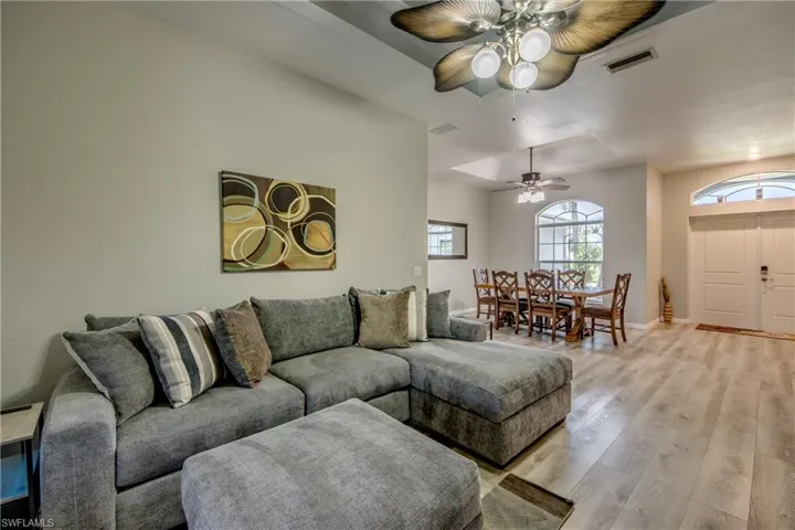 Living room featuring light wood-style floors and a ceiling fan