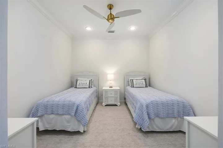 Bedroom featuring light carpet, ornamental molding, a ceiling fan, and recessed lighting and two Twin size beds