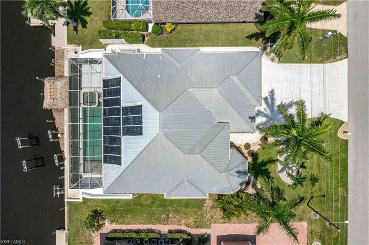 View of roof and property
