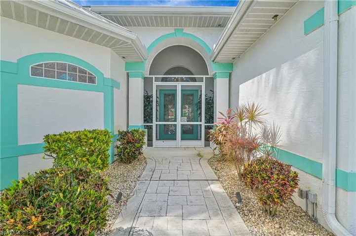 Property entrance featuring french doors