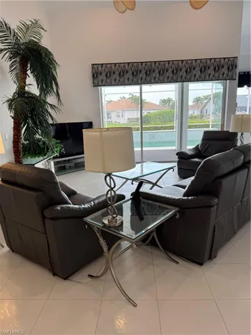 Living area featuring light tile patterned floors