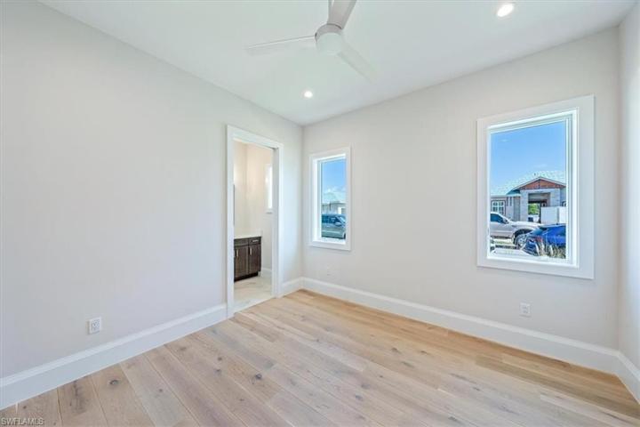 Bedroom 2 is located on the front of the home with a spacious and bright en-suite bathroom.