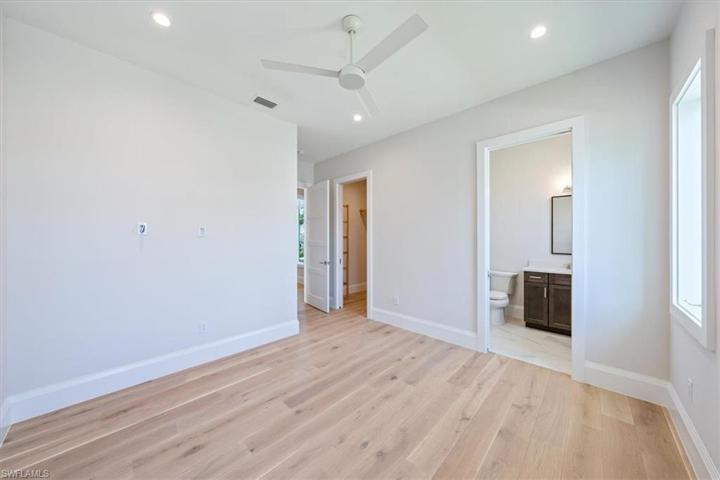 Bedroom 2 is located on the front of the home with a spacious and bright en-suite bathroom.