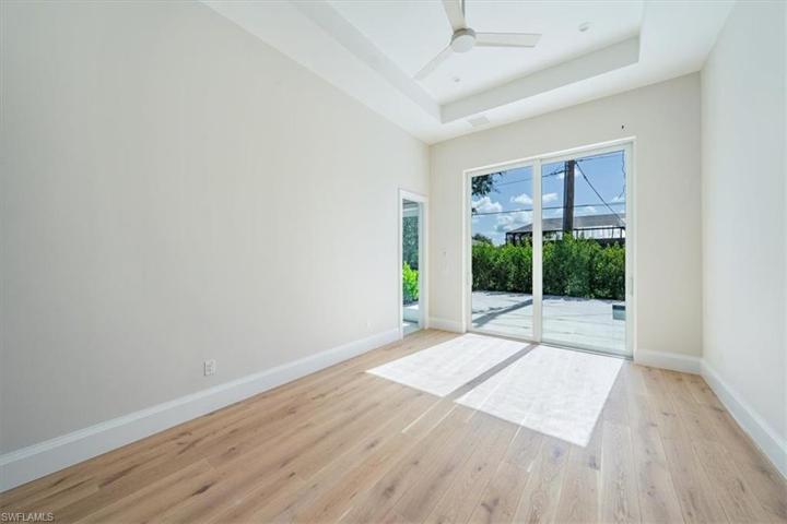 Bedroom 4 in the Dune plan is dubbed the Jr. Primary, with sliders out to the pool and a large en-suite with direct pool deck access.