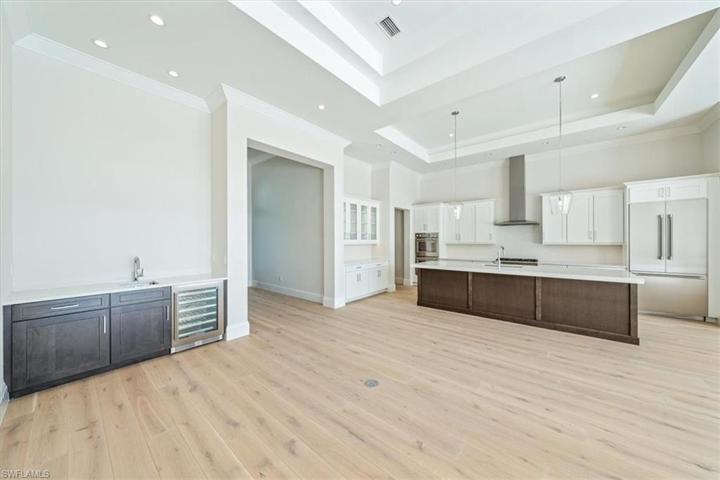 The great room features a wet bar with wine chiller.