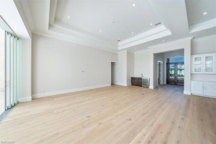 The great room features a wet bar with wine chiller.
