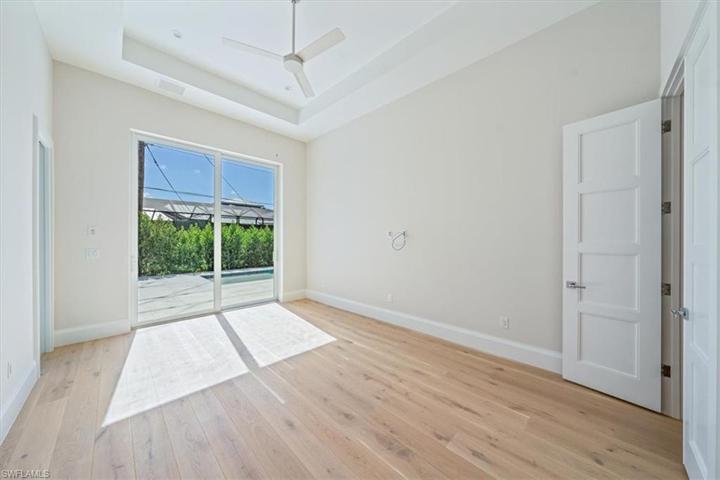Bedroom 4 in the Dune plan is dubbed the Jr. Primary, with sliders out to the pool and a large en-suite with direct pool deck access.