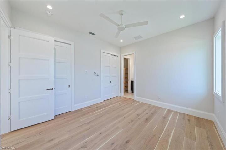 Bedroom 3 is tucked away toward the back of the home with dual closets and large en-suite bathroom with oversized linen closet.