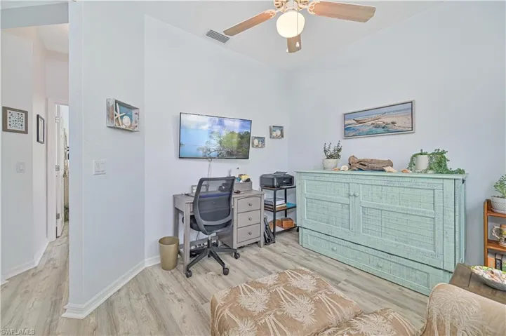 Office featuring ceiling fan and light hardwood / wood-style floors
