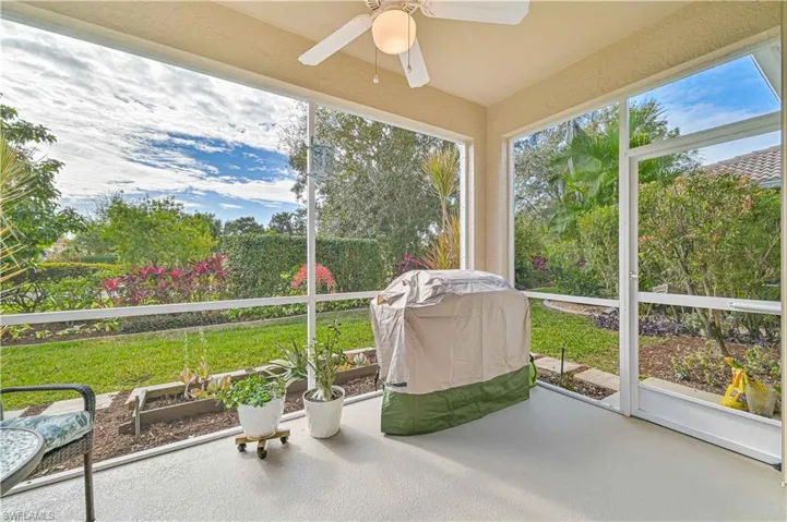 Unfurnished sunroom with ceiling fan