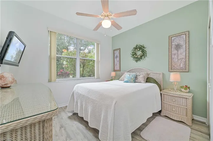 Bedroom featuring ceiling fan and light hardwood / wood-style floors