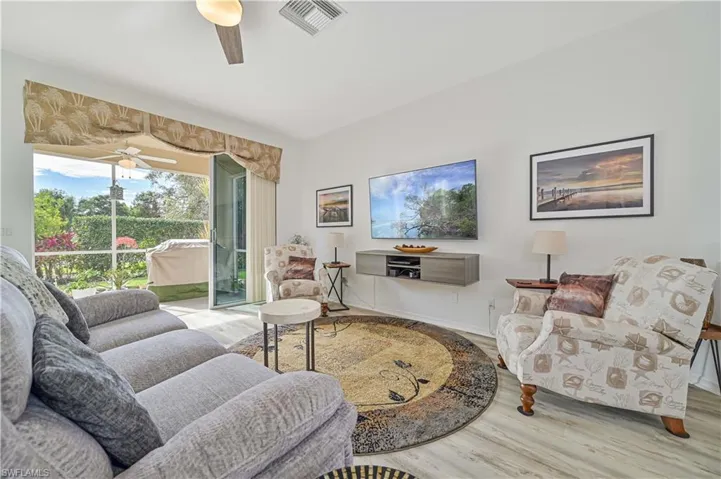 Living room with wood-type flooring