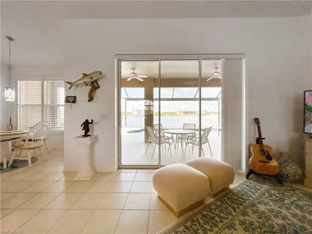 Doorway to outside with tile patterned floors