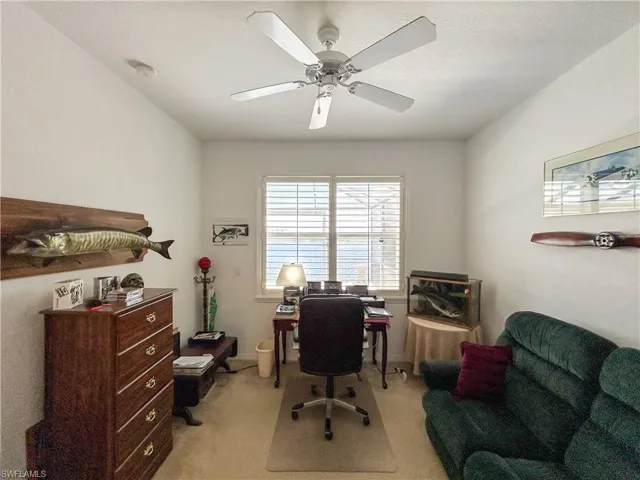 Office featuring light carpet and ceiling fan