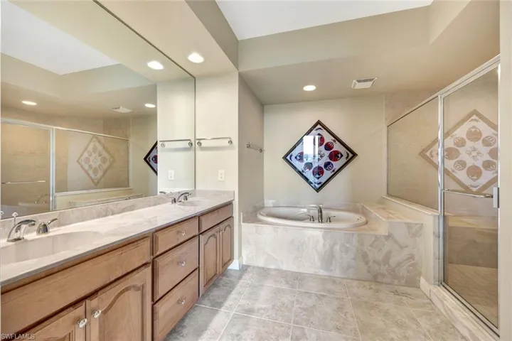 VIP Bath with Dual Vanities, Walk-in Shower + Tub, and Private Commode Room