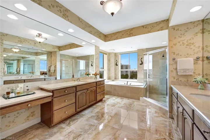 Dual Marble-Topped Vanities + Makeup Vanity in Owner's Bath